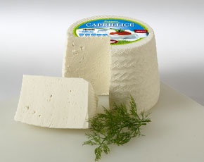 ... formatge de pasta semi premsada, freturosa d'escorÃ§a, de color blanc